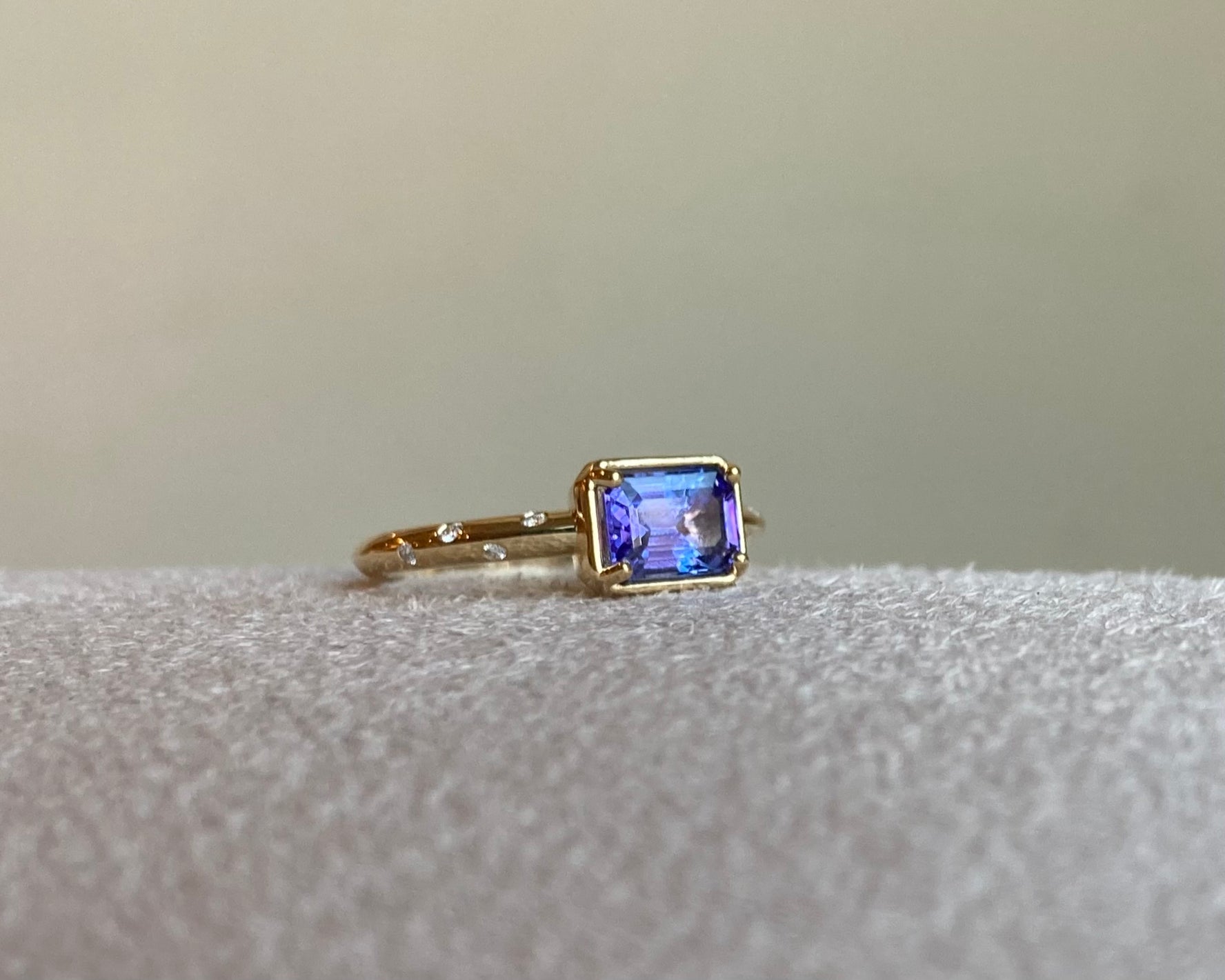 14k Tanzanite Ring with a Diamond Dotted Band - Emerald Cut