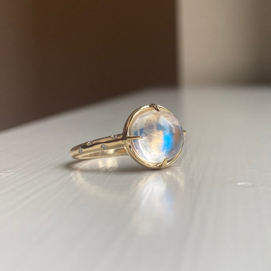 14k Moonstone Ring with a Diamond Dotted Band